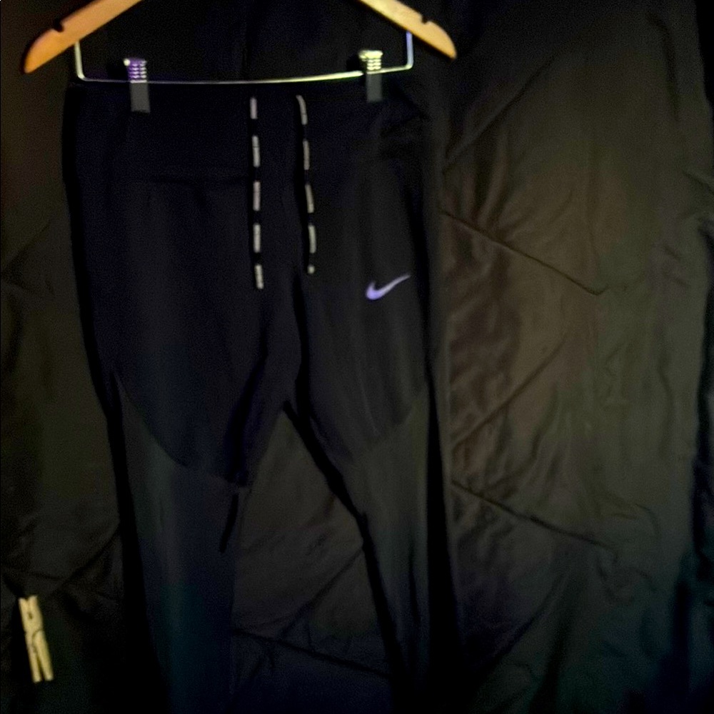 Black Nike Athletic Pants with Purple Logo